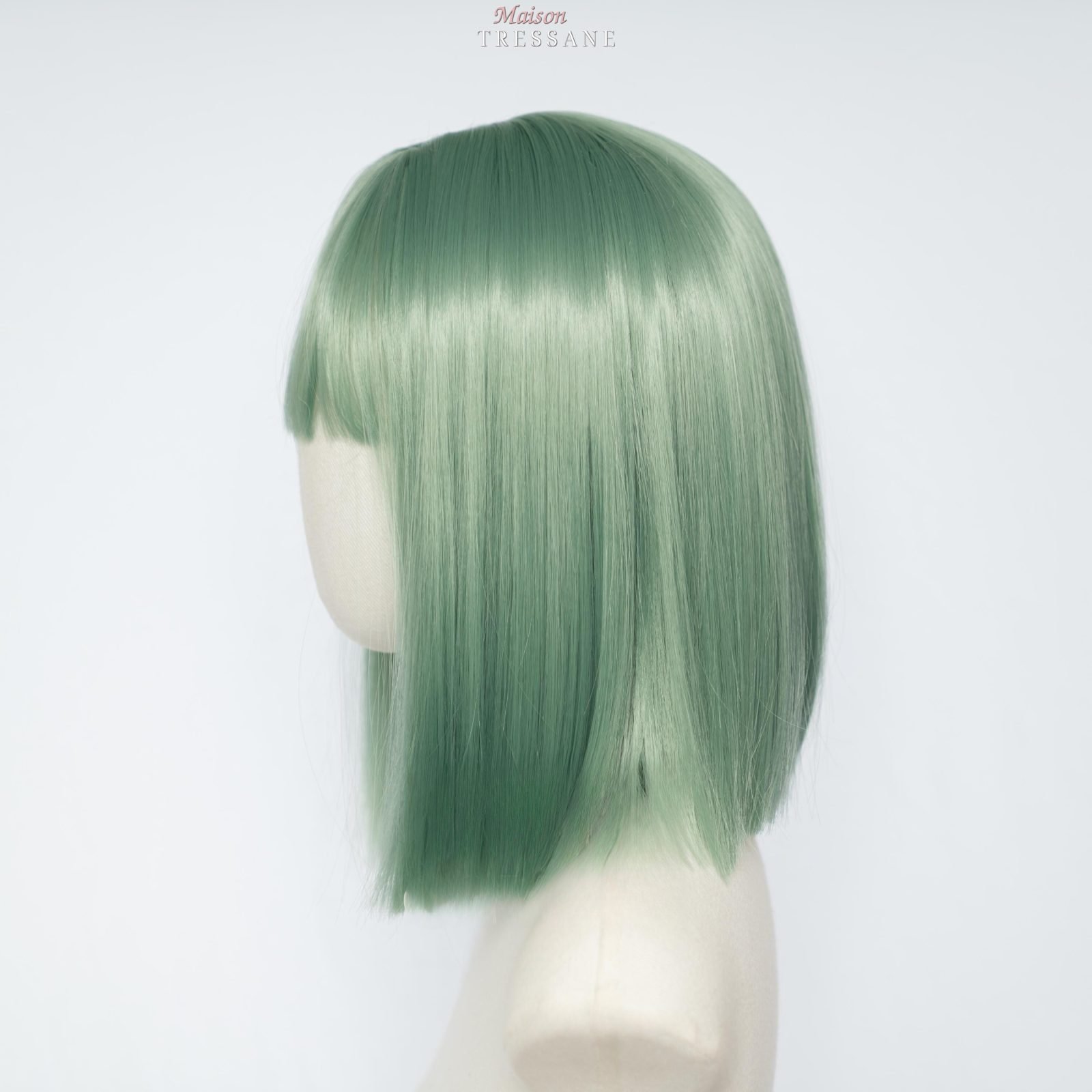 Perruque bob vert menthe avec frange — lisse, 25 cm, teinte vert — vue de trois quarts