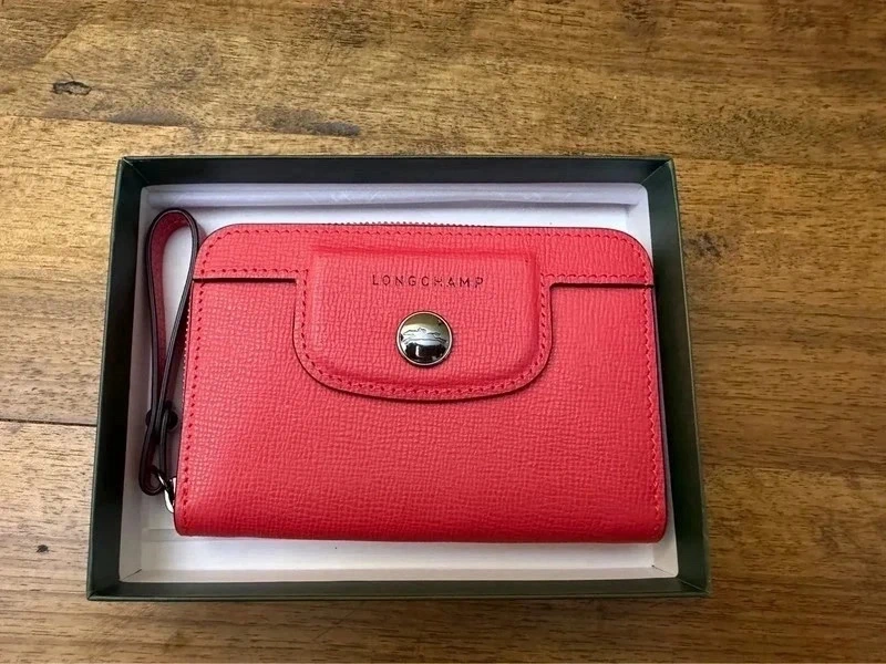Porte monnaie fuschia Longchamp Héritage TBE