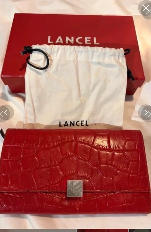 Lancel wallet made of red leather with a crocodile-effect embossed finish