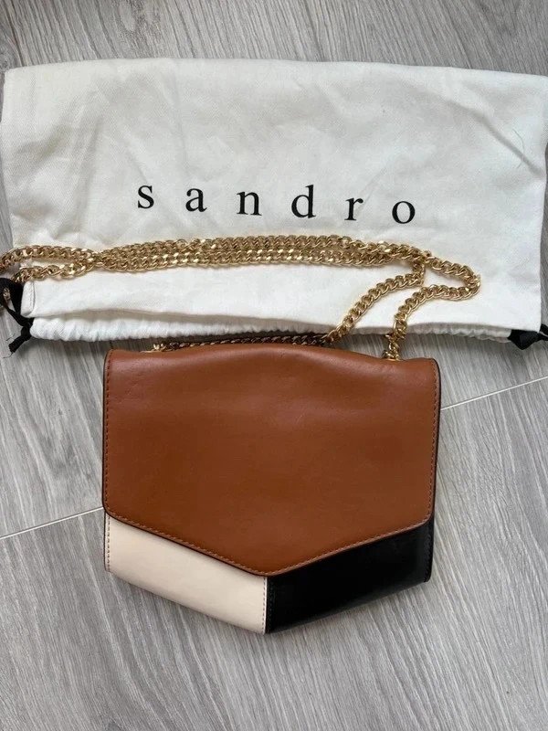 Sac Sandro en bandoulière, coloris noir, marron et beige, avec bandoulière dorée