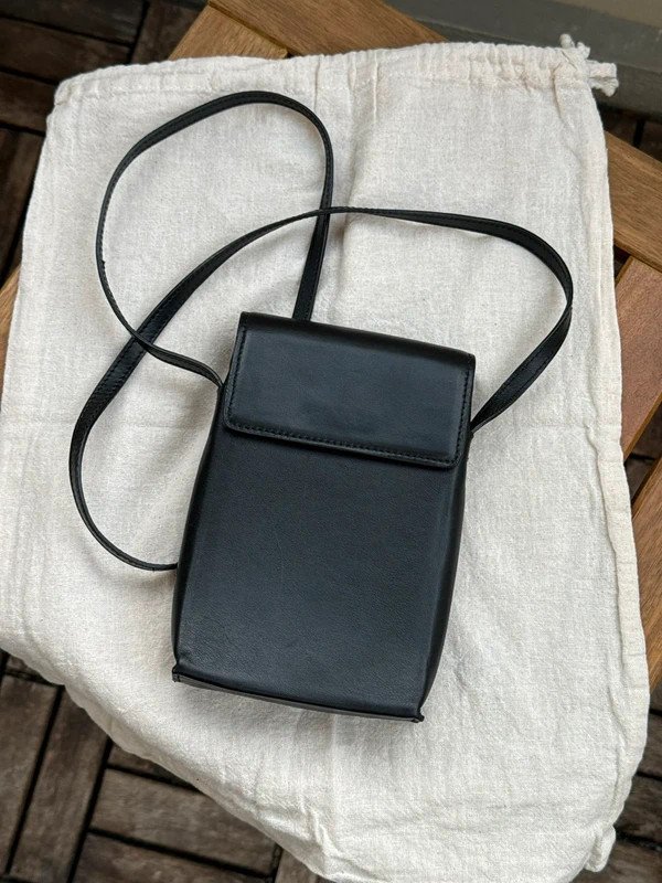 Pochette bandoulière en cuir Sandro