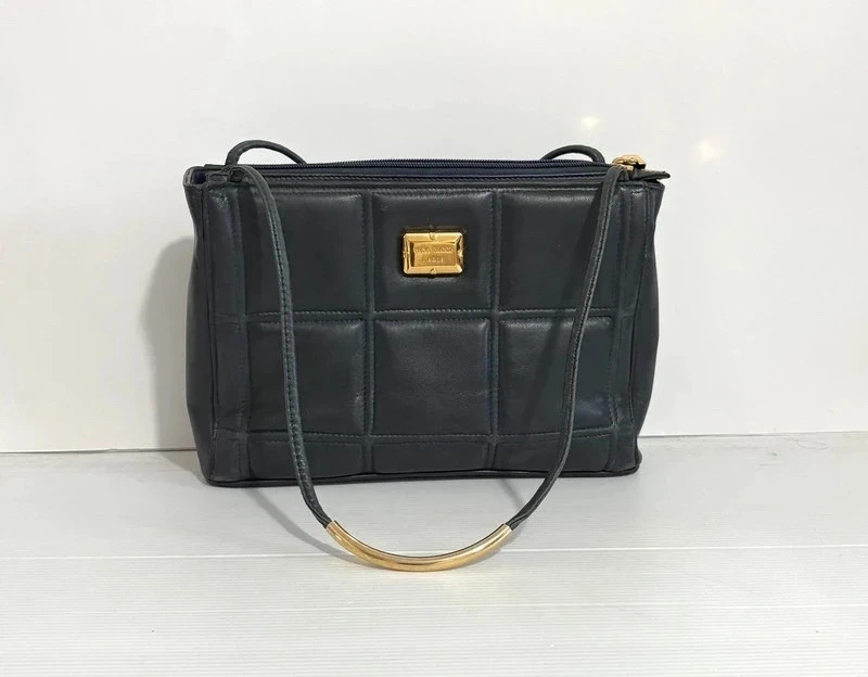 Sac Nina Ricci marine très bon état 26x18 cm double anse 48 cm